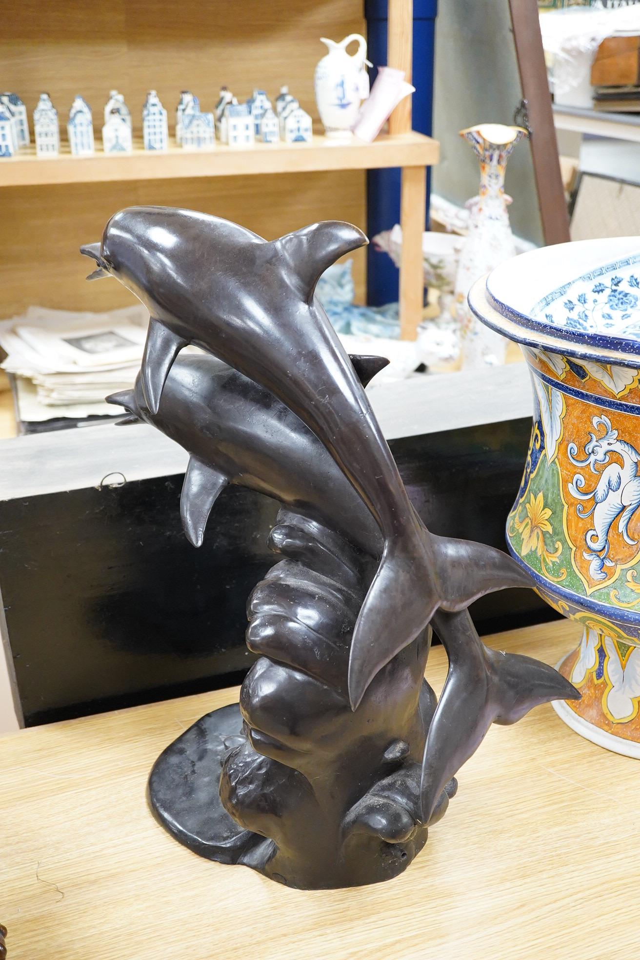 A large contemporary bronze dolphin fountain water feature, 61cm high